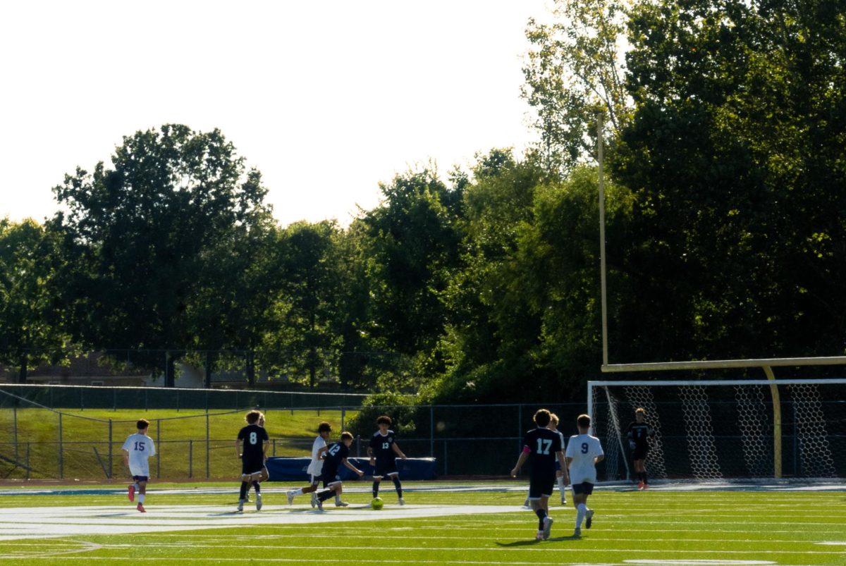 No.12 Easton Washam dribbles past each defender to get a good shot on goal. The whole offensive side of the ball had a really hard time scoring the whole game. 