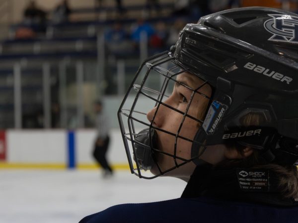 During the first quarter, freshman Davis Buschmann gazes up at his coach. The coaches pay close attention to the game and quickly give the athletes feedback and reprimands when necessary.
