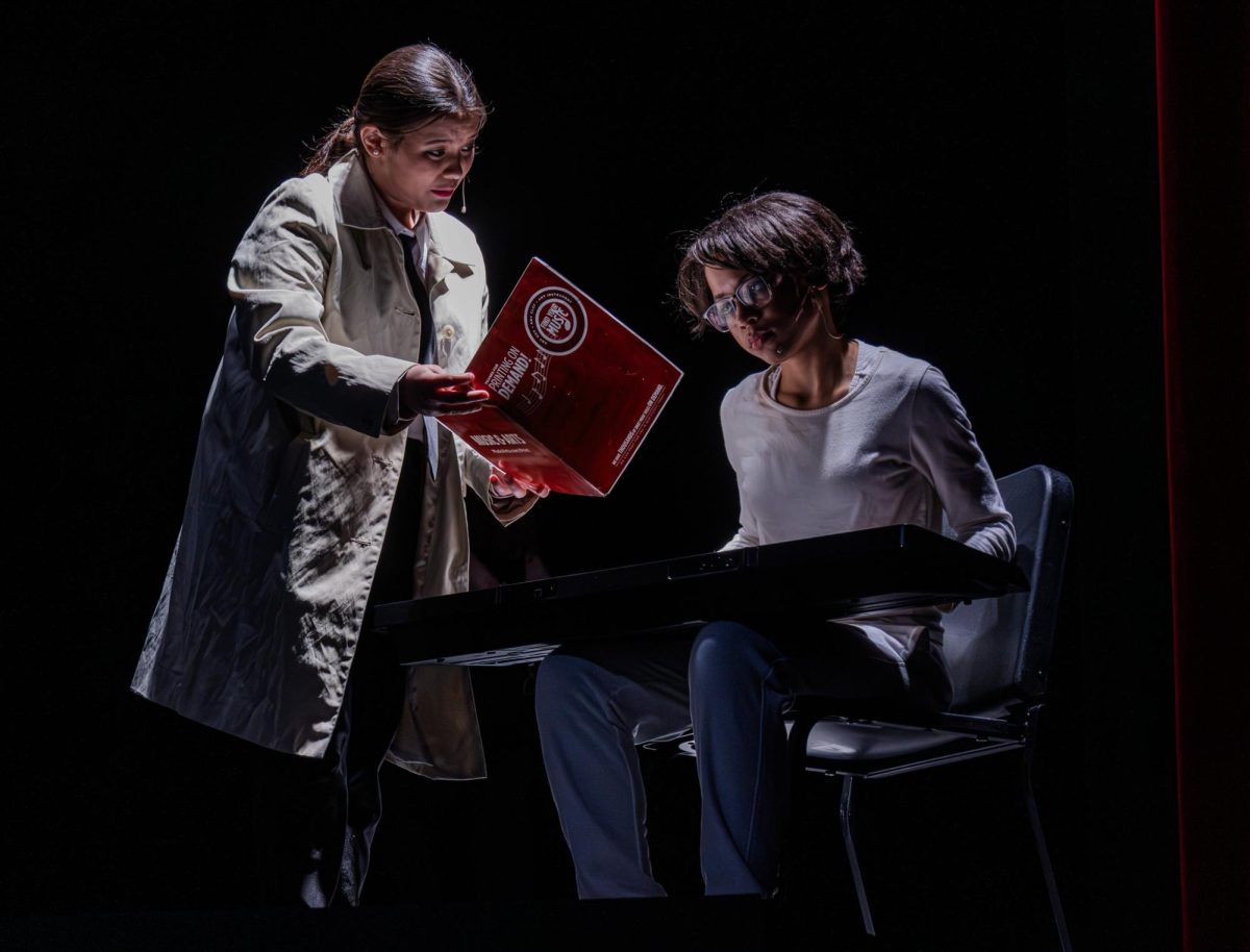 Senior Chole Biondo(playing as Heche) is trying to make Senior Mariah Creighton (playing as Angela) more comfortable by letting her play piano. Mariah Creighton was there when the Pharanochs put everyone in the play unconscious, but she was the lone survivor because she took extra doses of Inderal, a pill that suppressed anxiety that day. 
