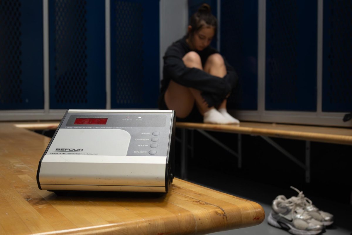 Wrestlers coward over the scale, due to the weight they have to gain or loose constantly fluctuating on the scale. 