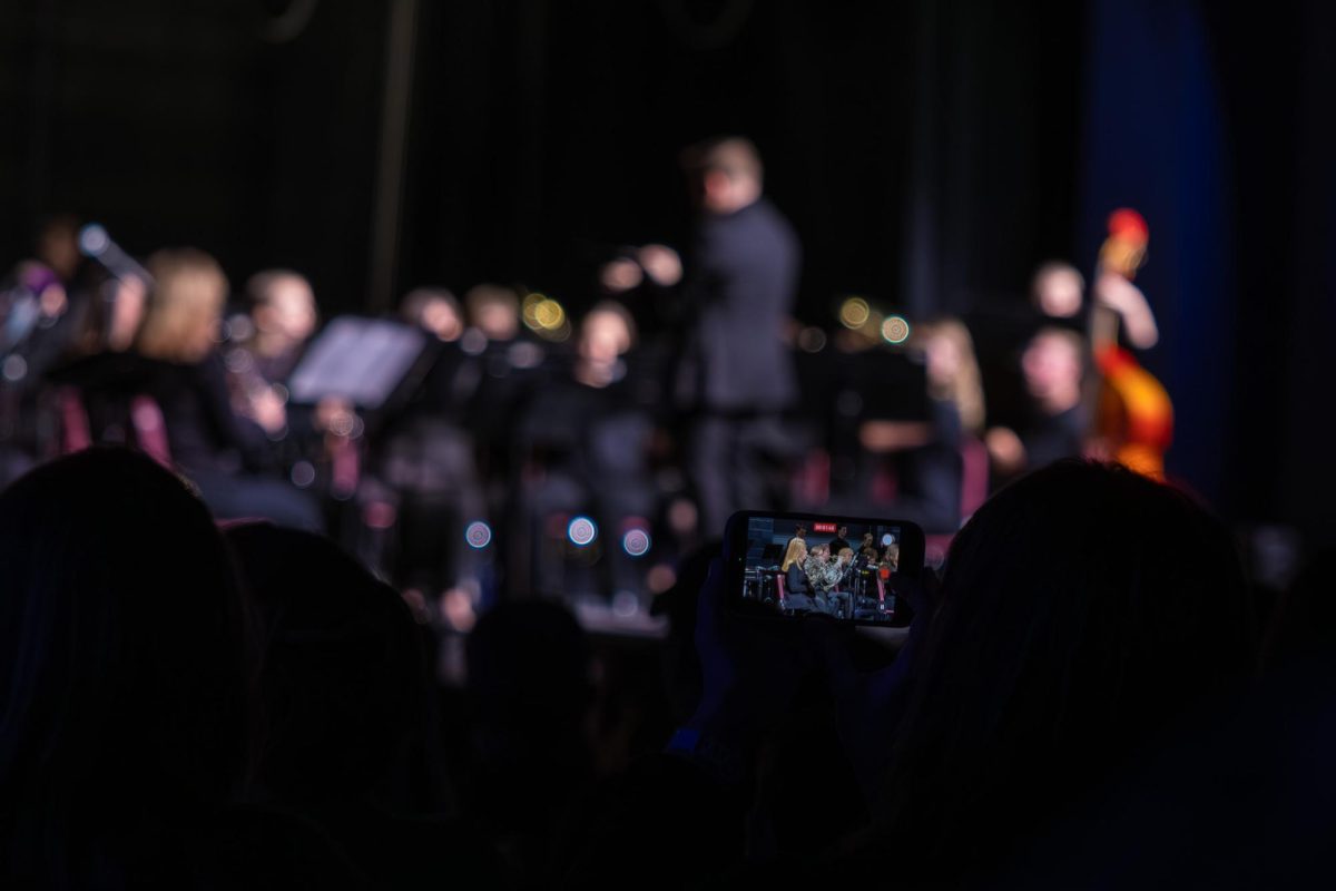 On Dec. 9, a parent records as the Symphonic Band puts on their winter performance. The band played their routinely rehearsed song “Christmas Fantasy”.