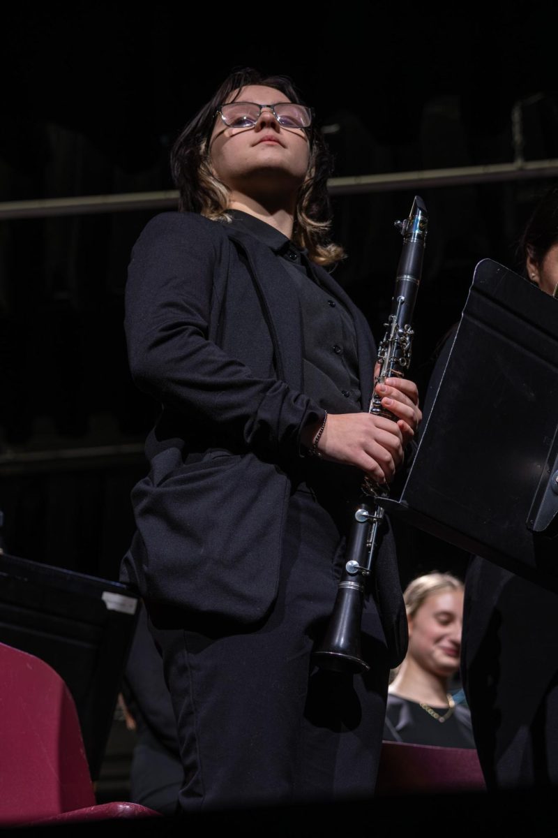 Standing up, sophomore Ellen Lovellete is recognized for making the All-state band on Dec. 9. After auditioning she made first alternate to play the flute. 
