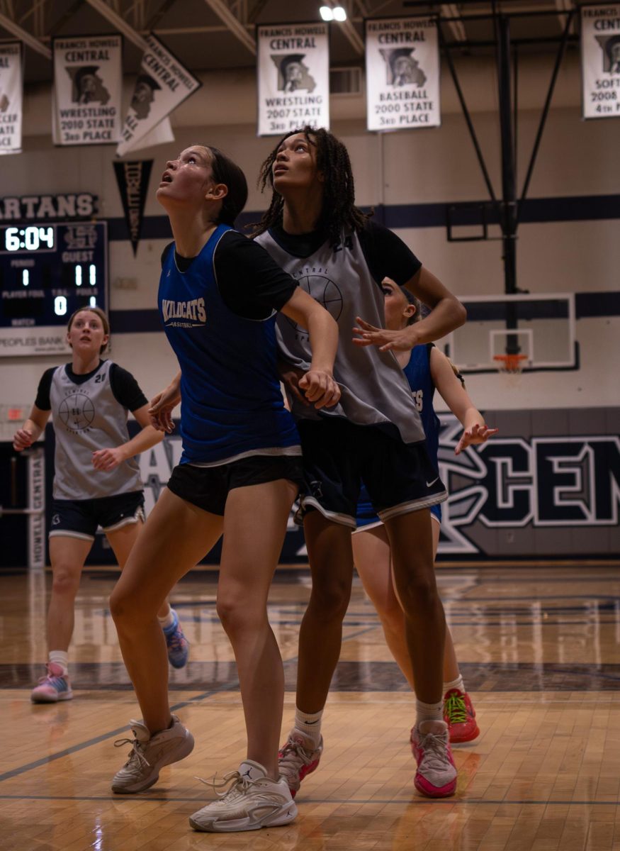 Upon shooting the ball during the jamboree on Nov. 18, Jayla Robinson watches as her ball flies into the air and makes its way into the basket. Robinson was between two of the Westminster players while they watched too.

