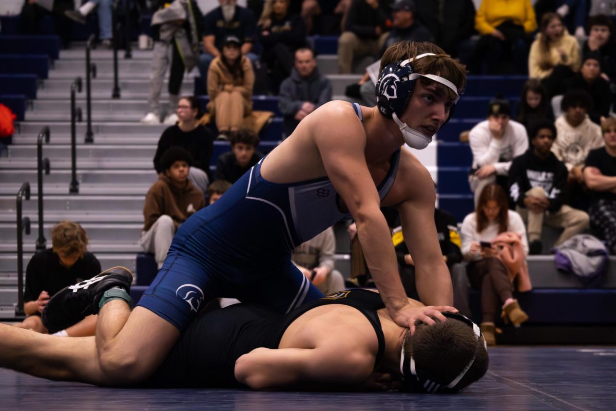After Braden Roussin got his opponent on the ground in a pinning position he begins to hold him down to get a successful win on Dec. 10. The time ended and Roussin was announced as the winner.
