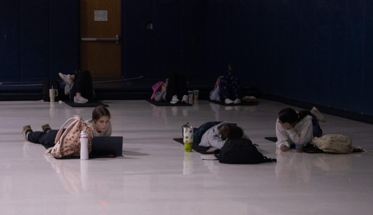 Fitness for life class laying on mats in order to meditate. The class goes on walks and meditates frequently placing the emphasis on self care and low impact exercises. 