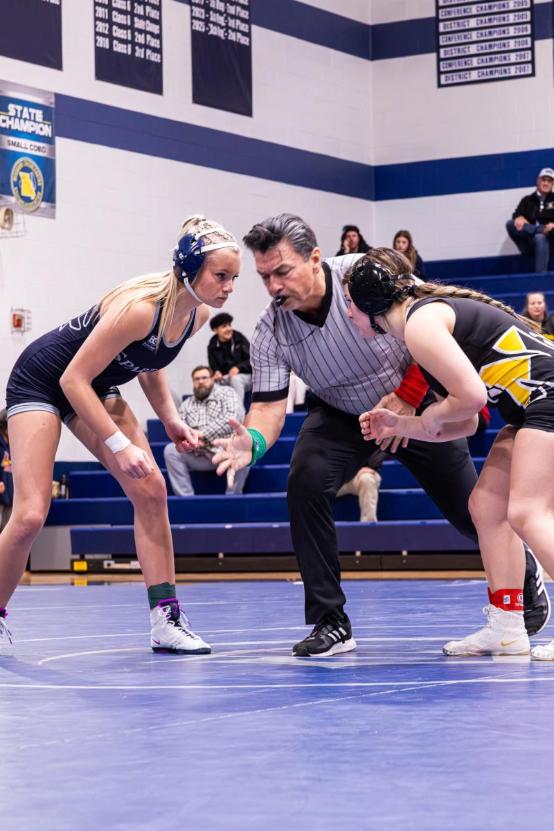 Zeroing in on the match on Nov. 20 , while it being the first one held as a home meet. Freshman Madelyn Callier prepared and focused in as she  awaited to hear the whistle be called to make her first move.
