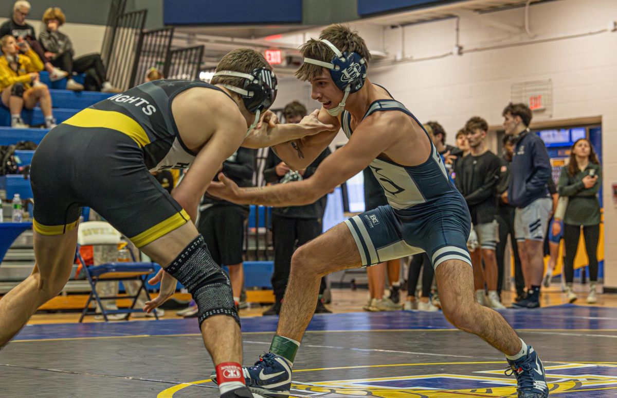 Trying to get an underhook on Jan 10, senior Chase Gray looks for a way to get a shot on the Francis Howell North wrestler. Gray then gets his opponent to the ground and gets his three points