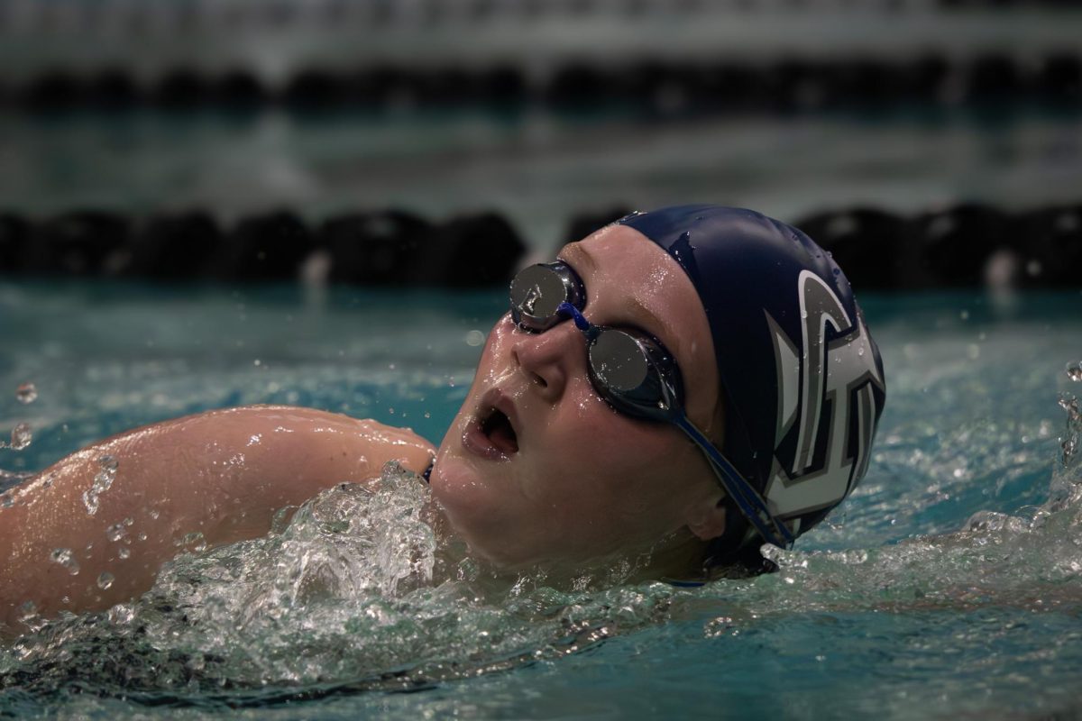 Making her laps during freestyle, Hollie Muschler keeps her breathing steady to balance out her stamina. Her teammates cheered her on as she pushed off the wall and kept going on Jan.13. 

