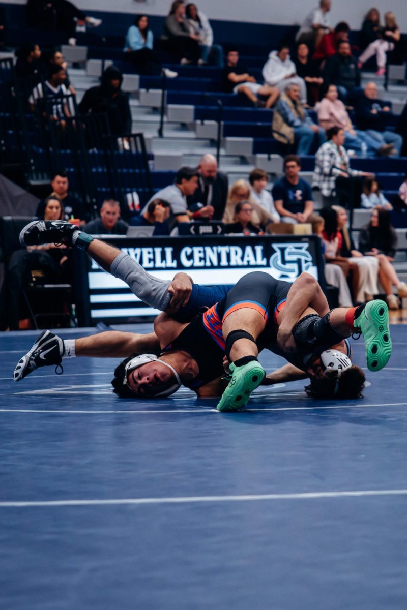 On Jan. 7, junior Owen Eisworth, is entangled with an opposing player from Liberty. Trying to get the upper hand, Eisworth flipped over putting his opponent on the bottom.
