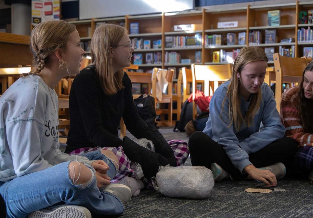 Epsilon Beta students are seen communicating about state conference. during a meeting after school in early January. 