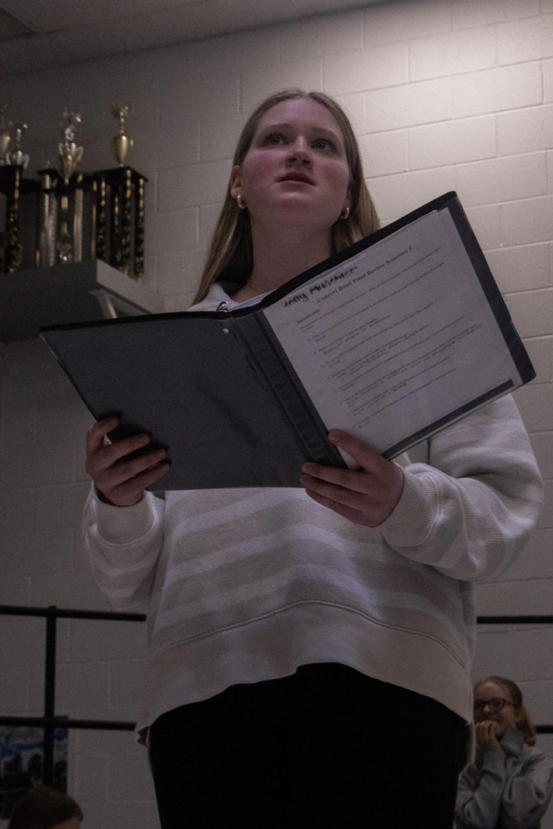 Basking in the glow of the lights on Feb. 13, Holly Muschler glances up as she passionately delivers her showcase audition in front of the class. The showcase concert is characterized by choreography to songs from musicals and movies, as well as many solos.