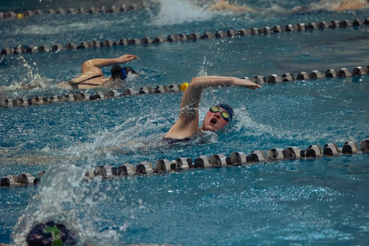 Junior Sarah Turner pushes through the 50 freestyle on Feb. 9. Turner didn’t medal, but she was an alternate during the second part of the Gateway Athletic Conference.