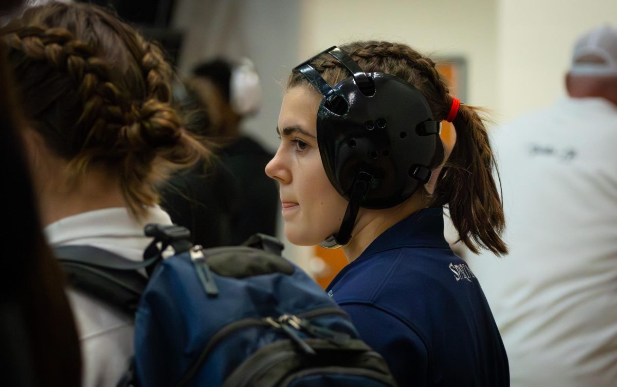 On Jan. 7, sophomore Kaitlyn Sparkman glances around, preparing herself for her match at GAC’s. Sparkman’s match was challenging, but she stood her ground to take the win.

