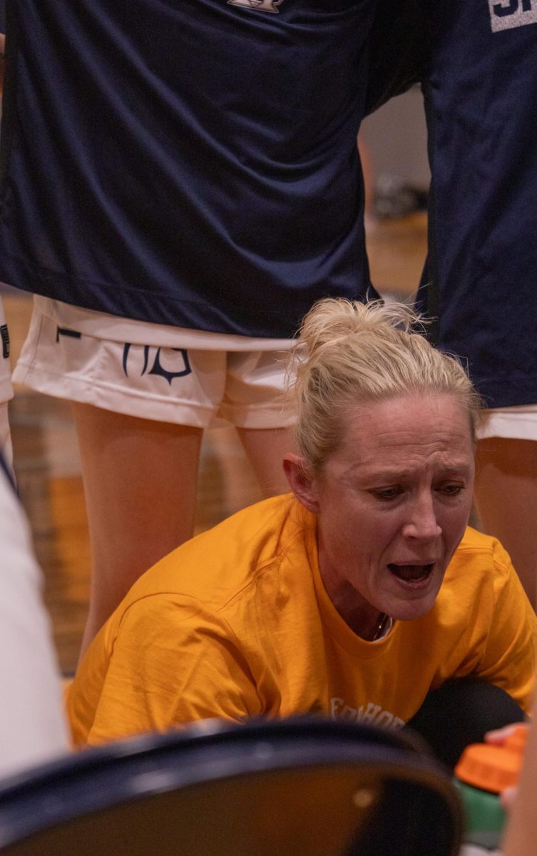 Before the second quarter is about to start, Coach Leake speaks to her team to tell them what to do to win the quarter. Leake was in the middle of all of them and showed them on her whiteboard the future plays on Feb. 17.