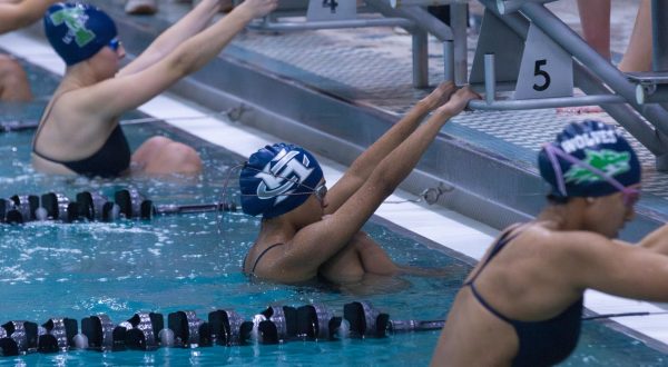 Holding onto the fifth starting block on Feb. 6, freshman Vihaana Subhash takes deep breaths to calm herself before the starting whistle. She prepares to launch herself into a backstroke as her muscles tense like her opponents from Timberland around her.