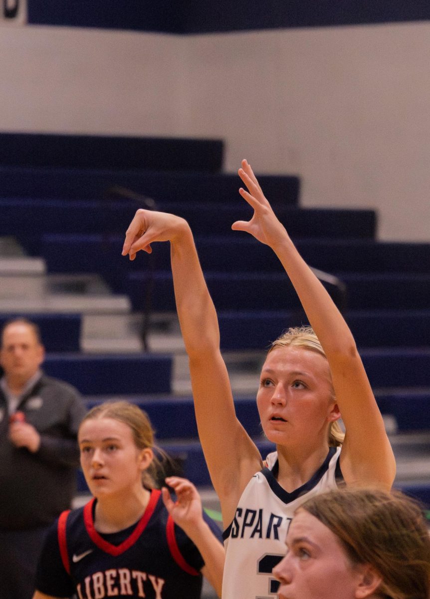 The opponent team has a foul resulting in a free throw on Feb. 17. Freshman Molly Hill shot with her teammates in lines next to her, and she flicked her wrists to have good technique.