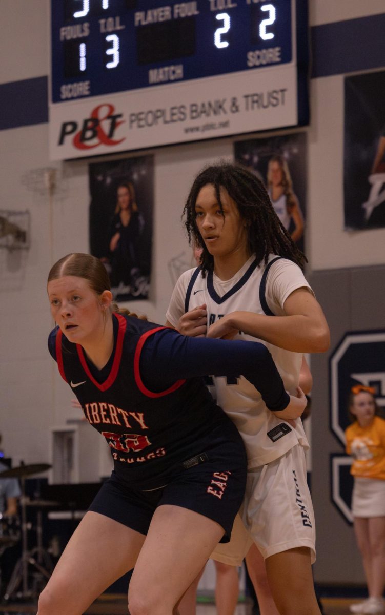 Junior Jayla Robinson is on defense and is making sure her opponent doesn’t get closer to the net to get a point. She pushed up against her to keep her where she is on Feb.17.