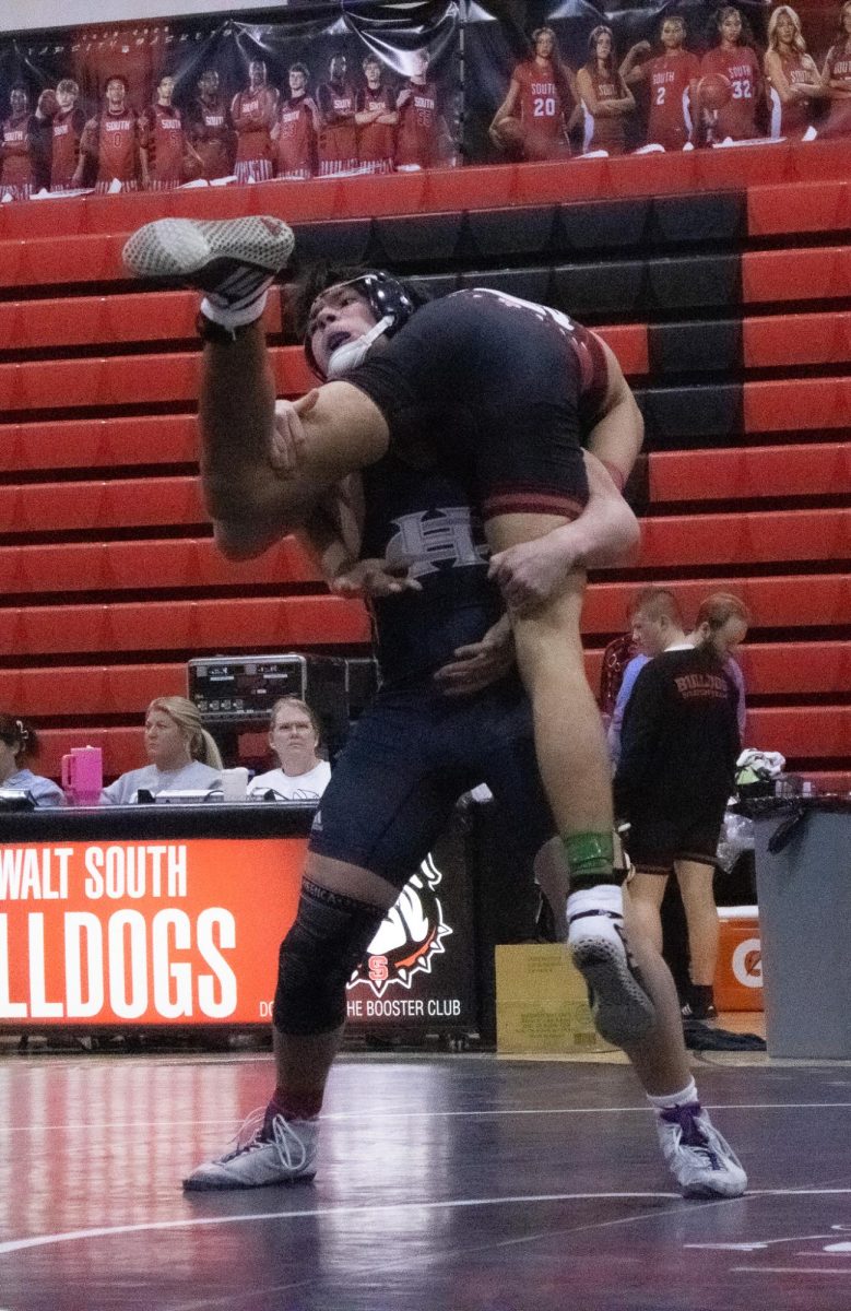 Lifting his opponent off the ground freshman Seth Nichols attempted to slam the other team's wrestler. The match is in its height and points are beginning to become crucial on Jan. 28.