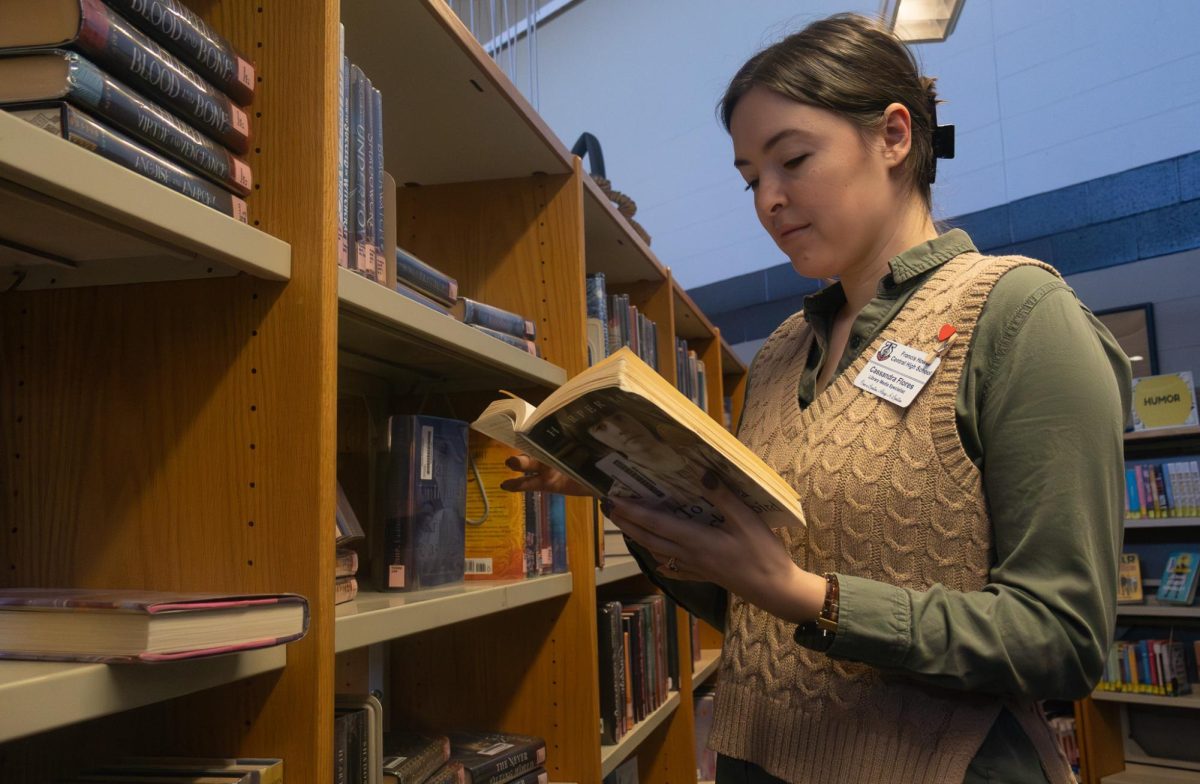 Cassie Flores is reading To Kill a Mockingbird by Harper Lee. This book is in the curriculum for Freshman, but has been a controversial book in the US for years.