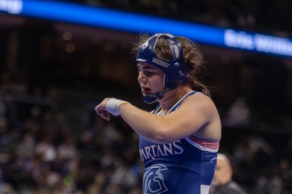 Wiping blood from her mouth, Kaitlyn Sparkman ends her match fighting for fifth place, but ultimately losing the match. All three periods were used and points were close, nearly allowing Sparkman to place higher.