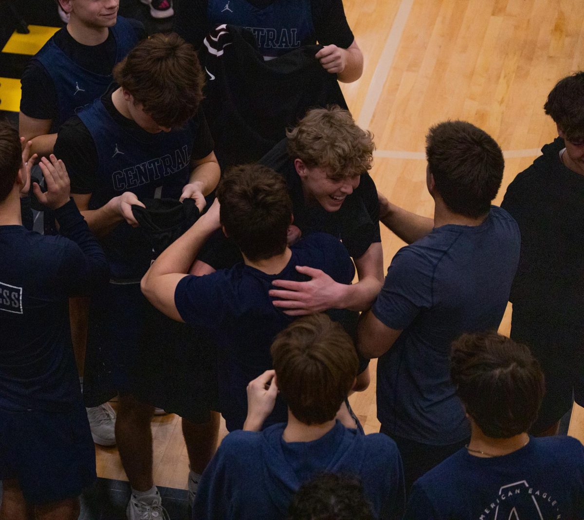 Junior Jack Getgood embraces a classmate after the game ends on Mar. 27. Getgood made multiple Three-point shots and skillful assists throughout the game.
