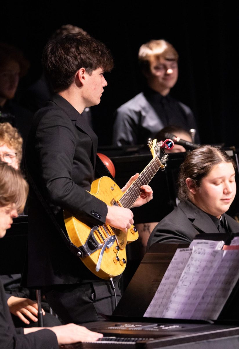 Senior Luke Stallings and Sirr Julian Rodriguez play their instruments at the winter jazz concert on Dec. 9. Their relationship with Rick Hayden, a professor at Southern Illinois University-Edwardsville has redefined their love for the art of music and improved their ability to play.