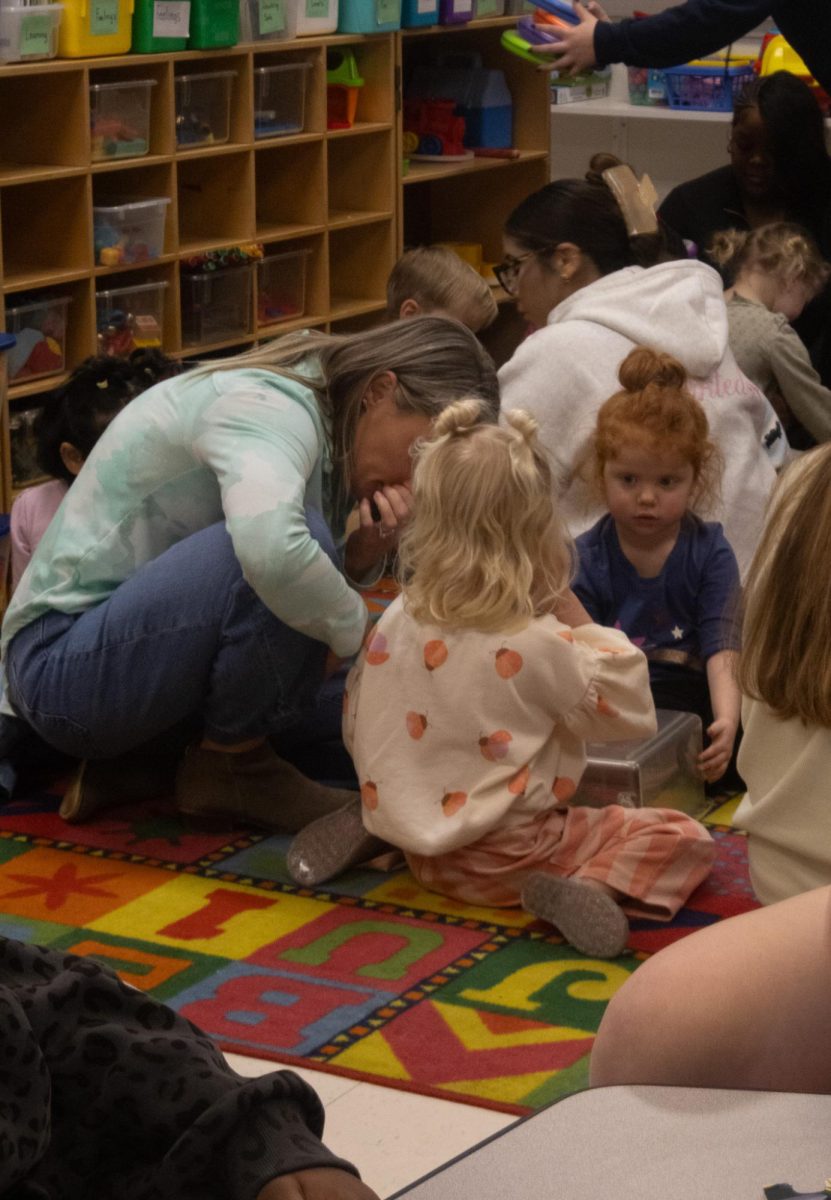 During a moment of play, Kathryn McGuire Steps in to explain to one of the little girls how she can play better. McGuire talks to the young girl about sharing and using her words to play with her friends properly.
