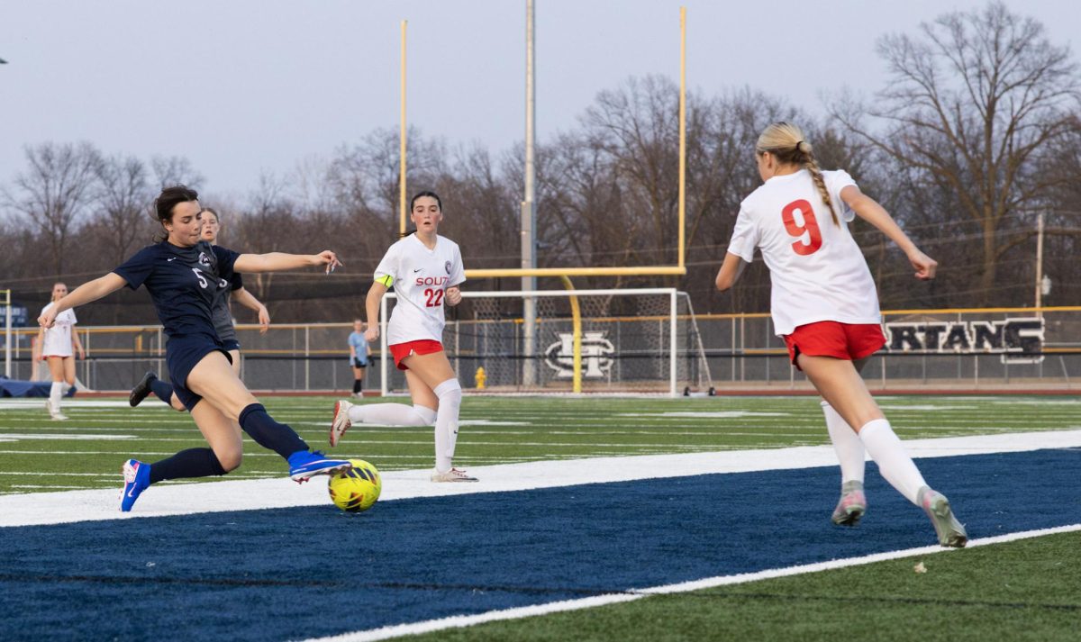 Freshman Victoria Lewis clears the ball so her opponents don’t gain possession during the first game of the year on March 21. Although the ball went out of bounds, it is more favorable than the opponent taking the ball.