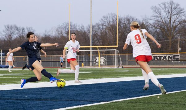 Freshman Victoria Lewis clears the ball so her opponents don’t gain possession during the first game of the year on March 21. Although the ball went out of bounds, it is more favorable than the opponent taking the ball.