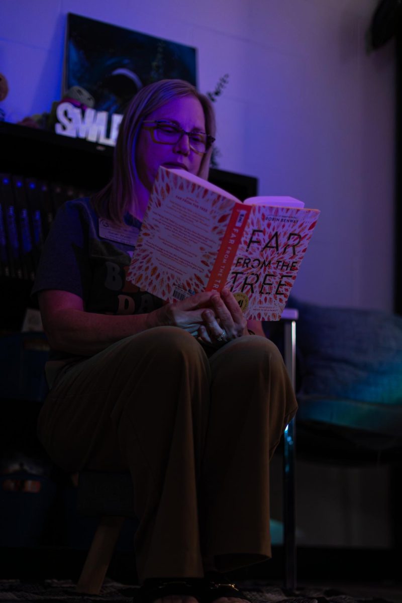 Mrs Sarah Wyeth is reading the book “Far from the Tree” by Robin Benway while having a sunlight lamp facing her. Neumann was recommended this book by Sarah LaRue.