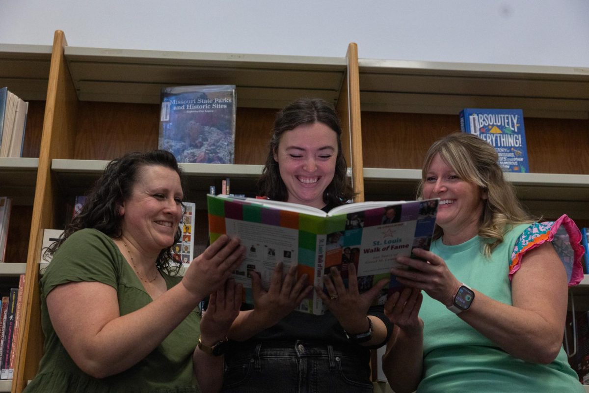 Mrs. Flores, Mrs. Smith and Mrs. Heimberger pictured reading a book on Apr. 24 in the learning commons. The FHC librarians take their jobs very seriously and do everything they can to keep the students at FHC enthralled with reading.