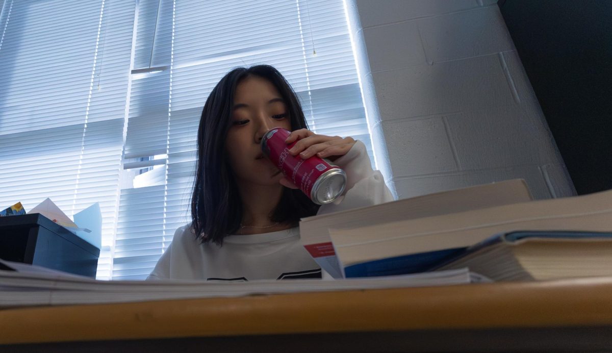 Anna Shi portrays students who drink energy drinks to stay awake. Many students will be found drinking energy drinks during the day, read more in Jarrett Reeds story "Caffeinated Chaos".