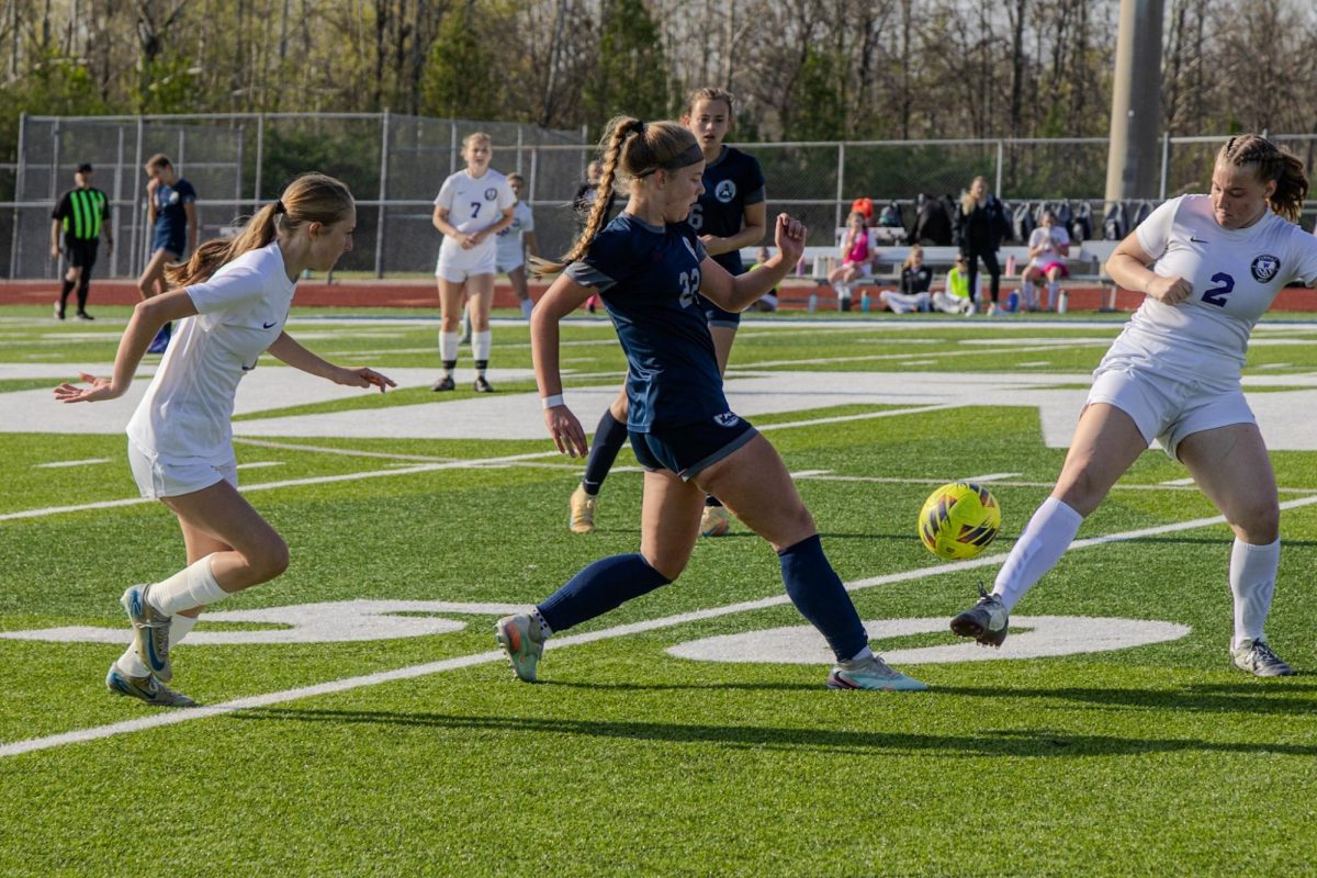 Taking a small step, sophomore Karsyn Black maneuvers her foot under the ball so that it would launch upwards on April 7. Right in front of her, however, stood another girl in her way ready to defend and refrain Central from coming close to their net.