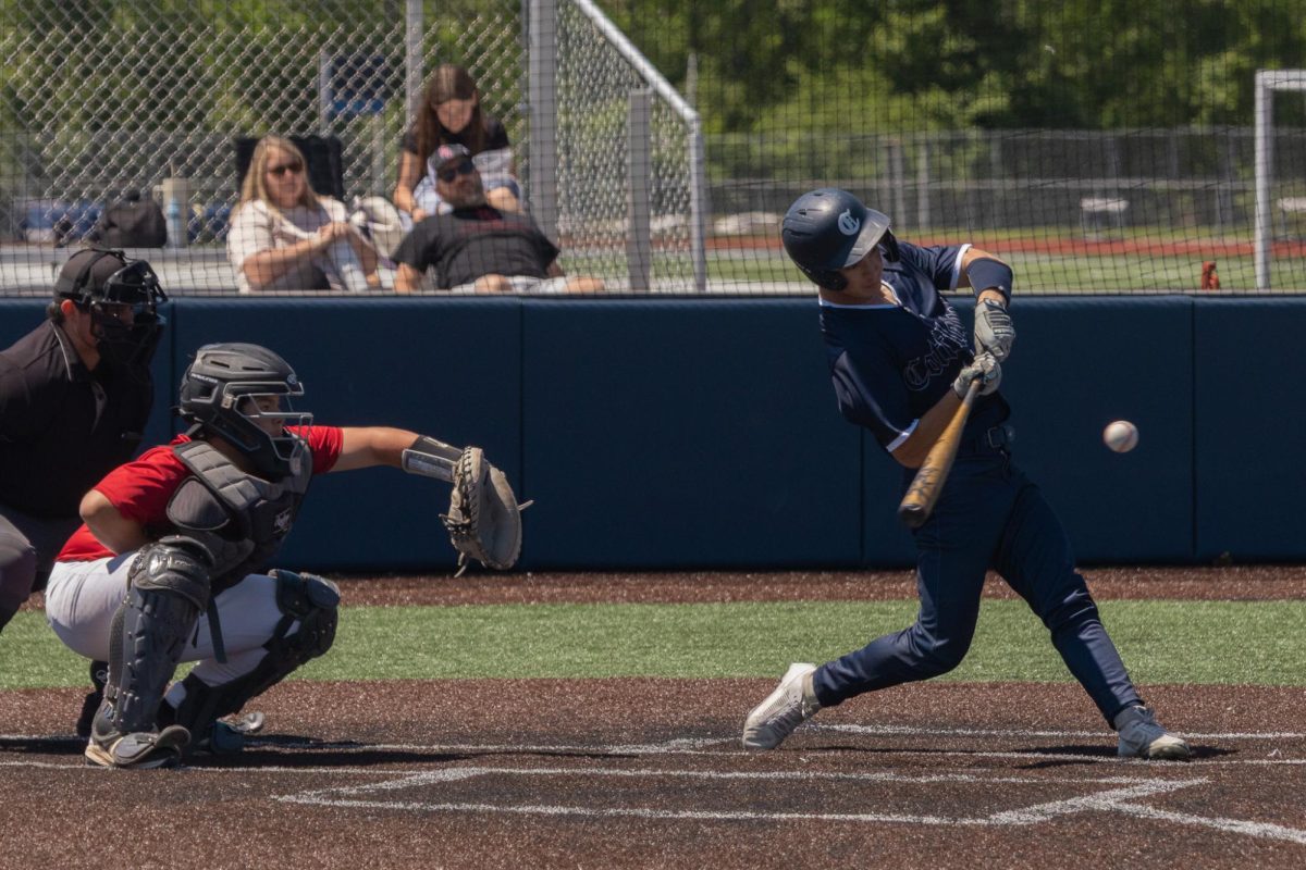 As his helmet tilts sideways on April 25, Will Brown keeps his eyes on the pitch as he tries to hit it. He turned his back foot to channel as much power as he could when he made contact. 