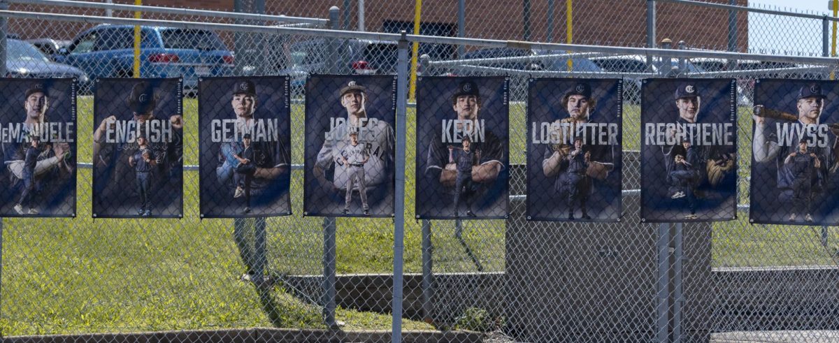 As the sun shines down on the fence on April 25, it illuminates the senior posters hung from the chain links. The eight seniors will be celebrated soon with a ceremony and will receive recognition for their years of high school athletics.
