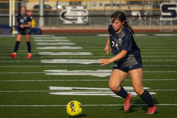 Freshman Selah Rodriguez escapes from Marquette's defensive pressure and looks for an open teammate to shoot to on April 14. Rodriguez’s eyes glanced to her left and charged up to kick.