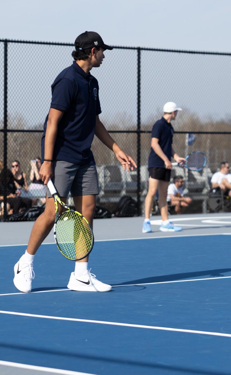  Tejas Marathe and junior Luke Wiehage stand ready on March 20 during their doubles match. They talked back and forth for the ball, communication and positioning matter most in these moments.