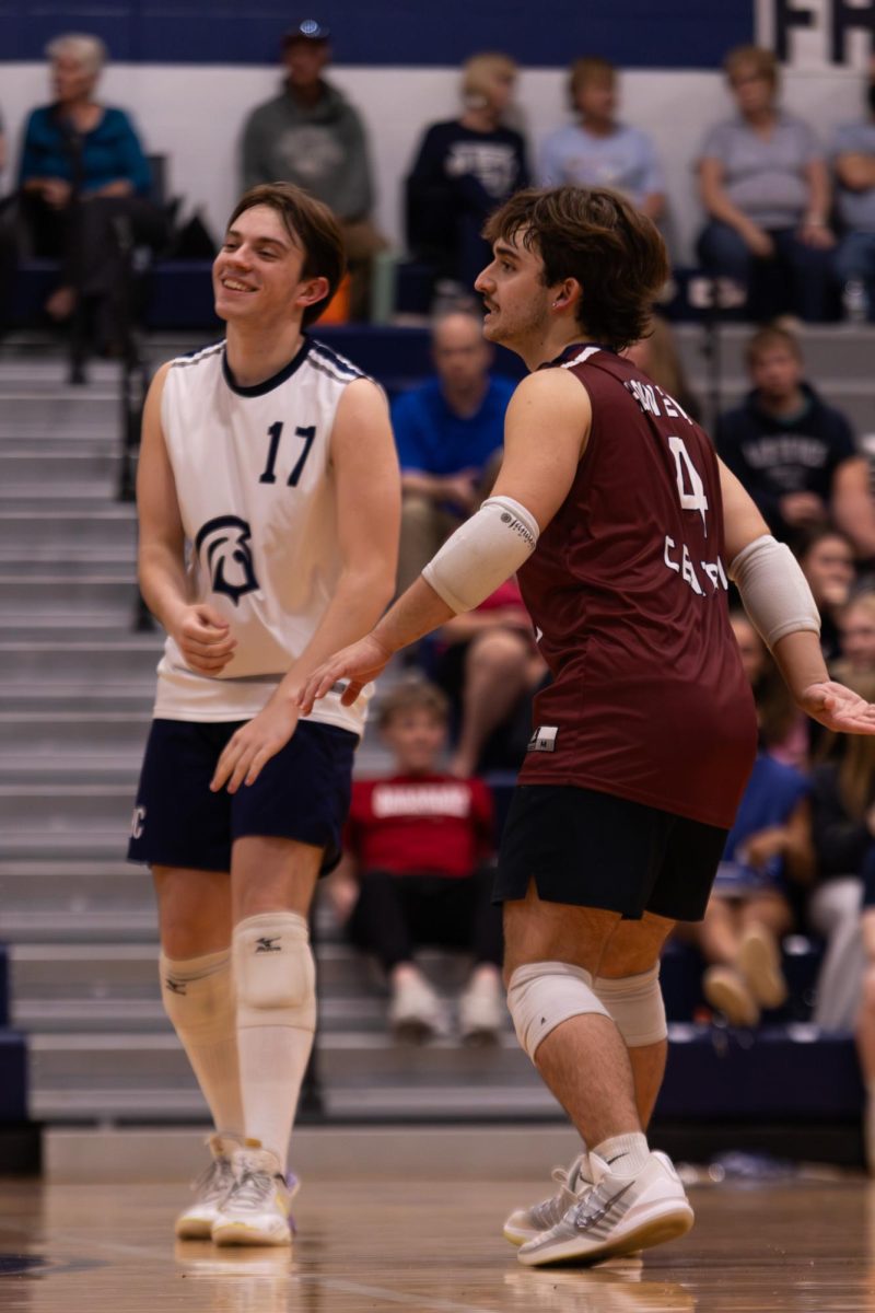 Sharing a quick fist bump, Braden Harton and Josh Hadden go back towards their positions. The team continued to keep each other motivated throughout the game on April. 21.