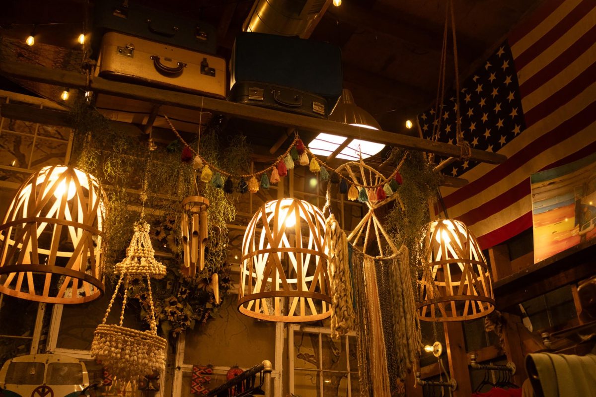 The collective market on Main Street remains open, inviting visitors in from the quiet side walk. Decorative lights dangle from the ceiling, illuminating the shop. Different knick-knacks fill the walls and even the ceilings of the store, leaving adventure in every corner.