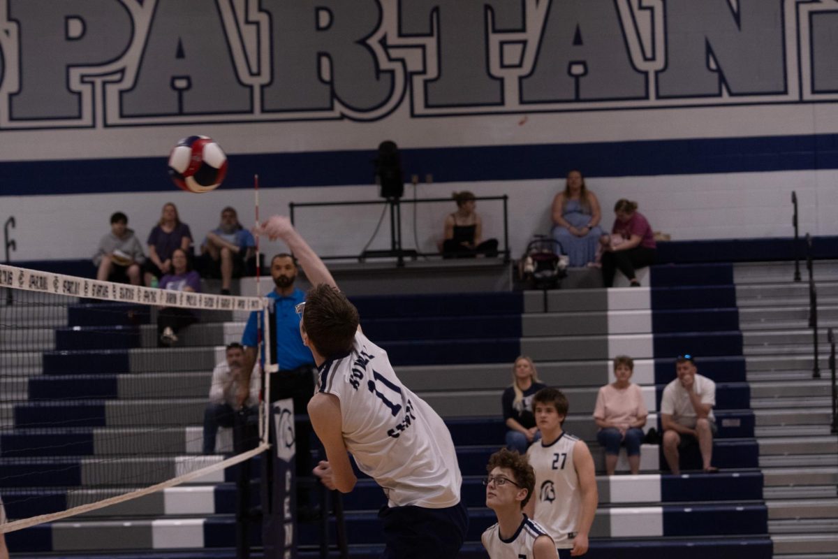 Galen Davis hits the ball across the court on April 23. An important part of smashing a ball is hitting it away from the blockers on the opposing team, making a cross-court shot optimal.