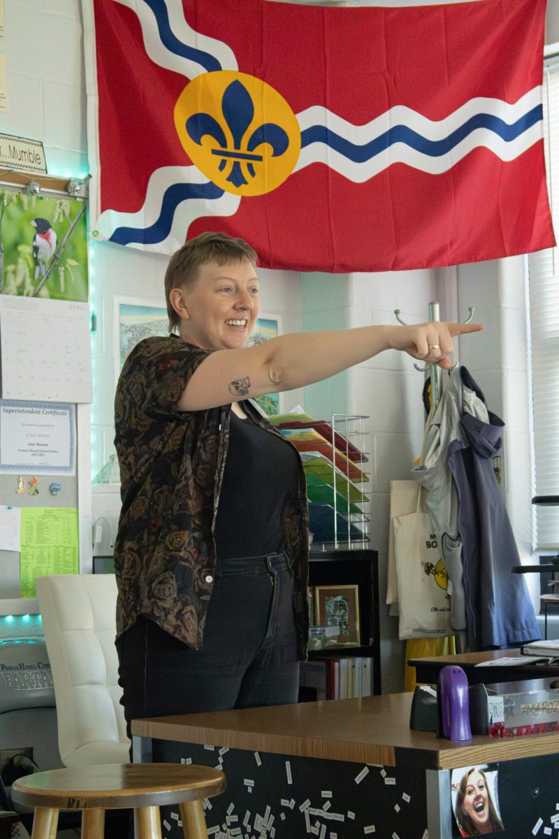 Standing up pointing at her student, Dr. Amy Roznos always makes sure that her students are participating by practicing their French. Roznos incorporates different cultures from various french speaking countries in her lessons.
