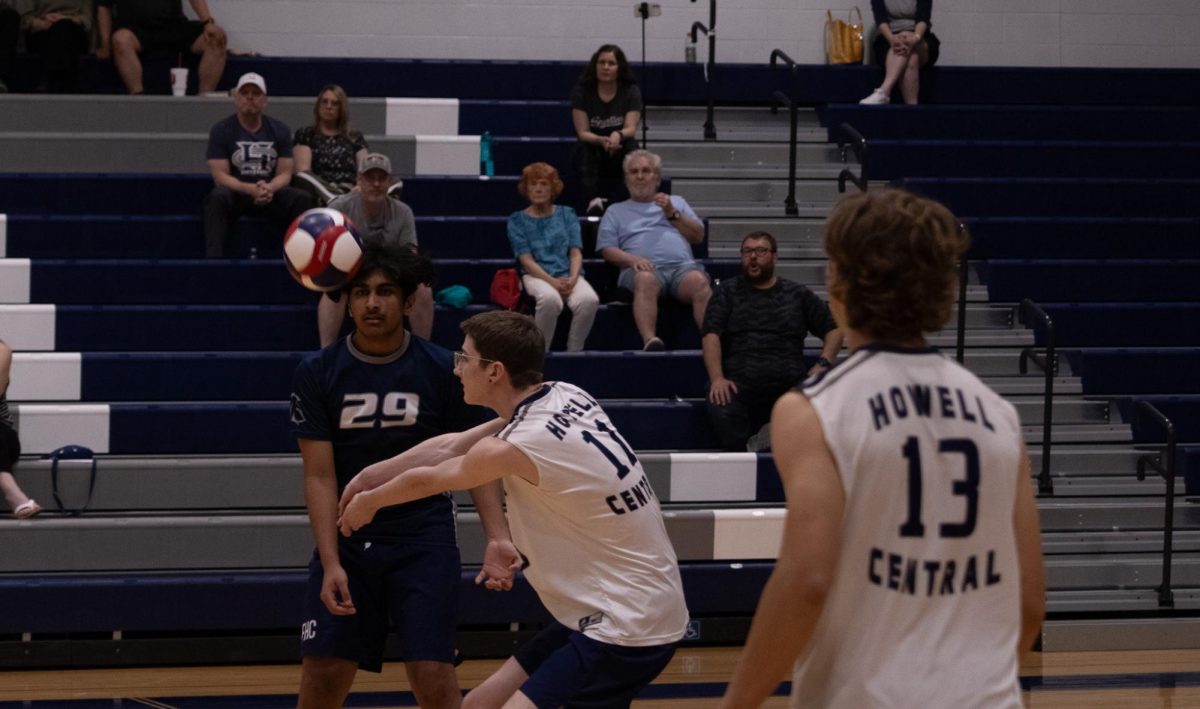Sophomore Galen Davis passes the ball on April 23, getting low for control, allowing for a controlled set and attack. With multiple people in the back row, it requires quick communication to decide who is going to get the ball.