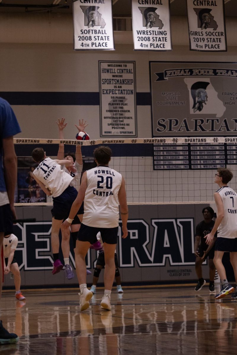 After spiking the ball, sophomore Galen Davis fell back to the court on April 23. The ball ricochets off the defender into the net, giving the Spartans the point.
