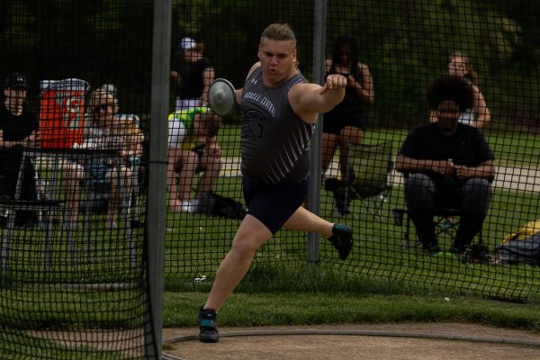 Senior Matt Hopkins throws discus for one of his other throwing events. Discus is another event that the throwing team participates in and is similar to shotput. 