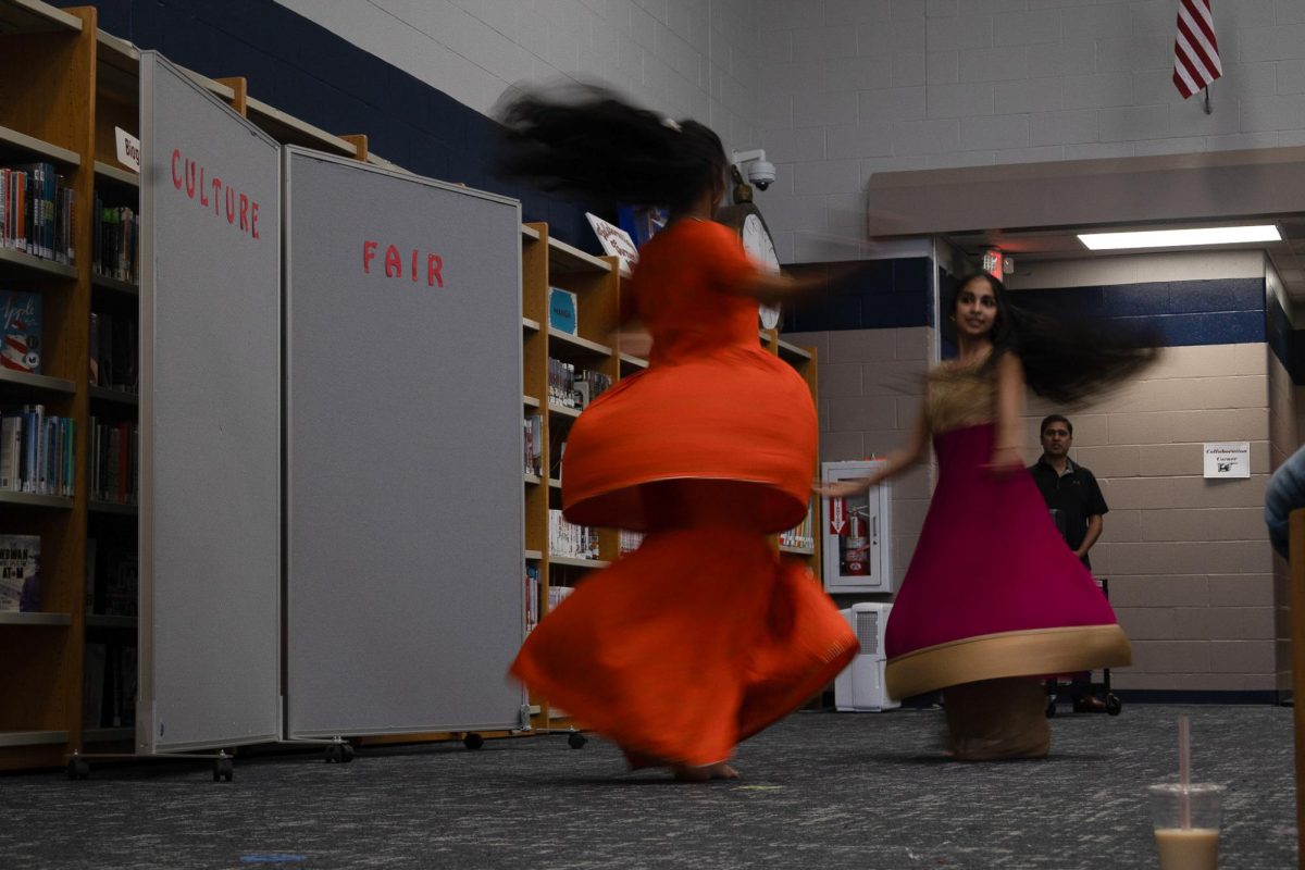 Spinning during their dance on April 28, Pranjal Hankare’s dress expands in a bell shape. Representing India, Hankare performed two cultural dances during the culture fair.