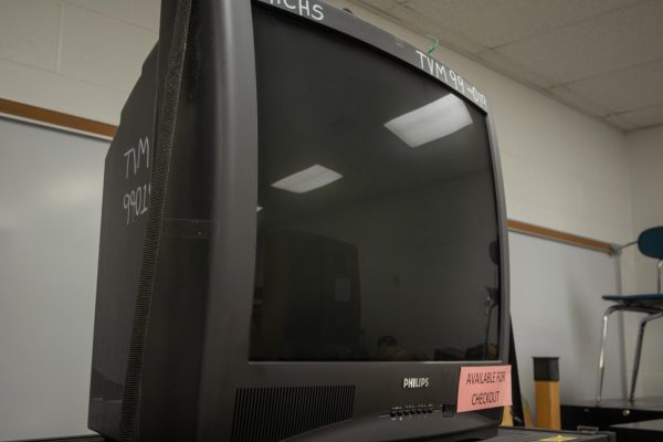 A retro computer sits alone in the back of a storage room. This symbolizes the rapid innovation of technology to become more advanced.