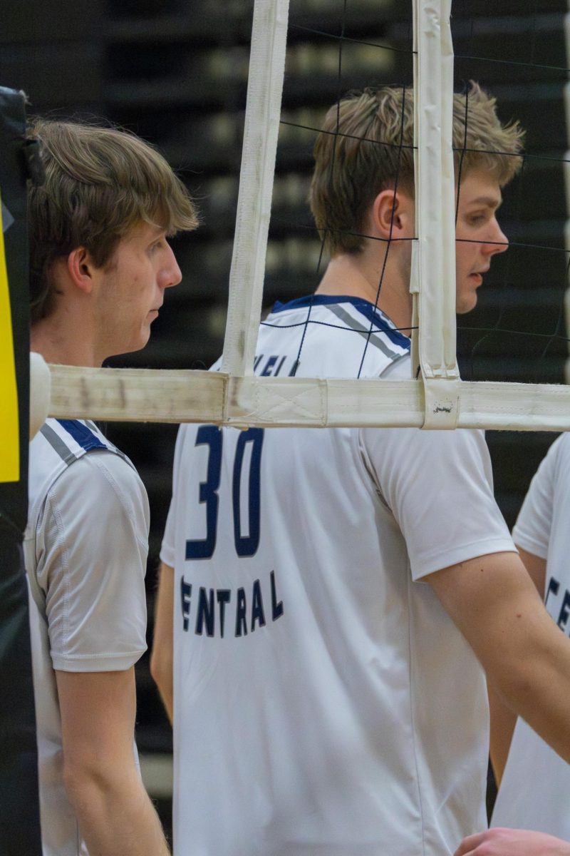 Shaking hands with the opposite team, senior Chase Rugh says good game before celebrating the win at the game on May 2. This is to show respect to the opposite team.