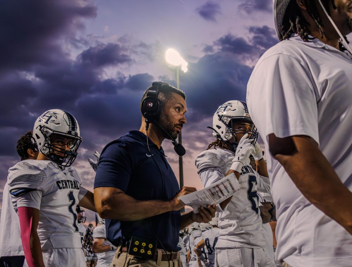 As the Spartans prepare for the second half, Coach Devon Thomas takes a moment to gather his thoughts near the end of the first half. With the score close, the team planned to adjust and push through for the second half.