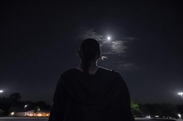 Valerie Sappington looks up at the full moon in awe. The Artemis II crew landed on earth at exactly 8:07 EDT April 10th.