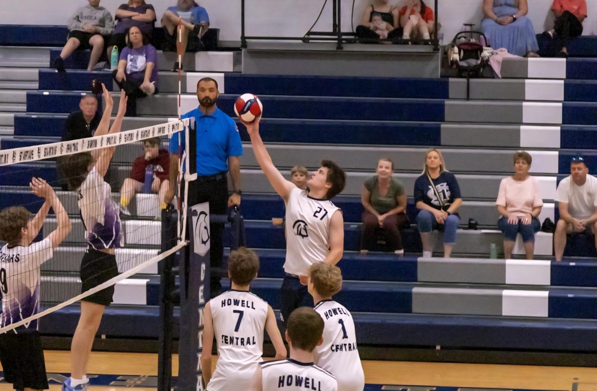 Sophomore Lucas VonFeldt leaps into the arm at set the ball at the April 23 game. As a right-side hitter, it is VonFeldt's job to protect the right side of the net.